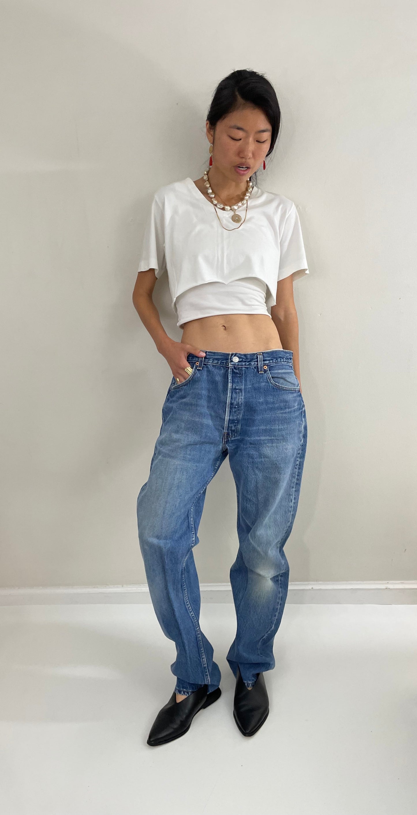 Vintage 80s Levis 501 button fly soft faded tall boyfriend baggy medium wash Levis jeans made in USA size 33 x 34