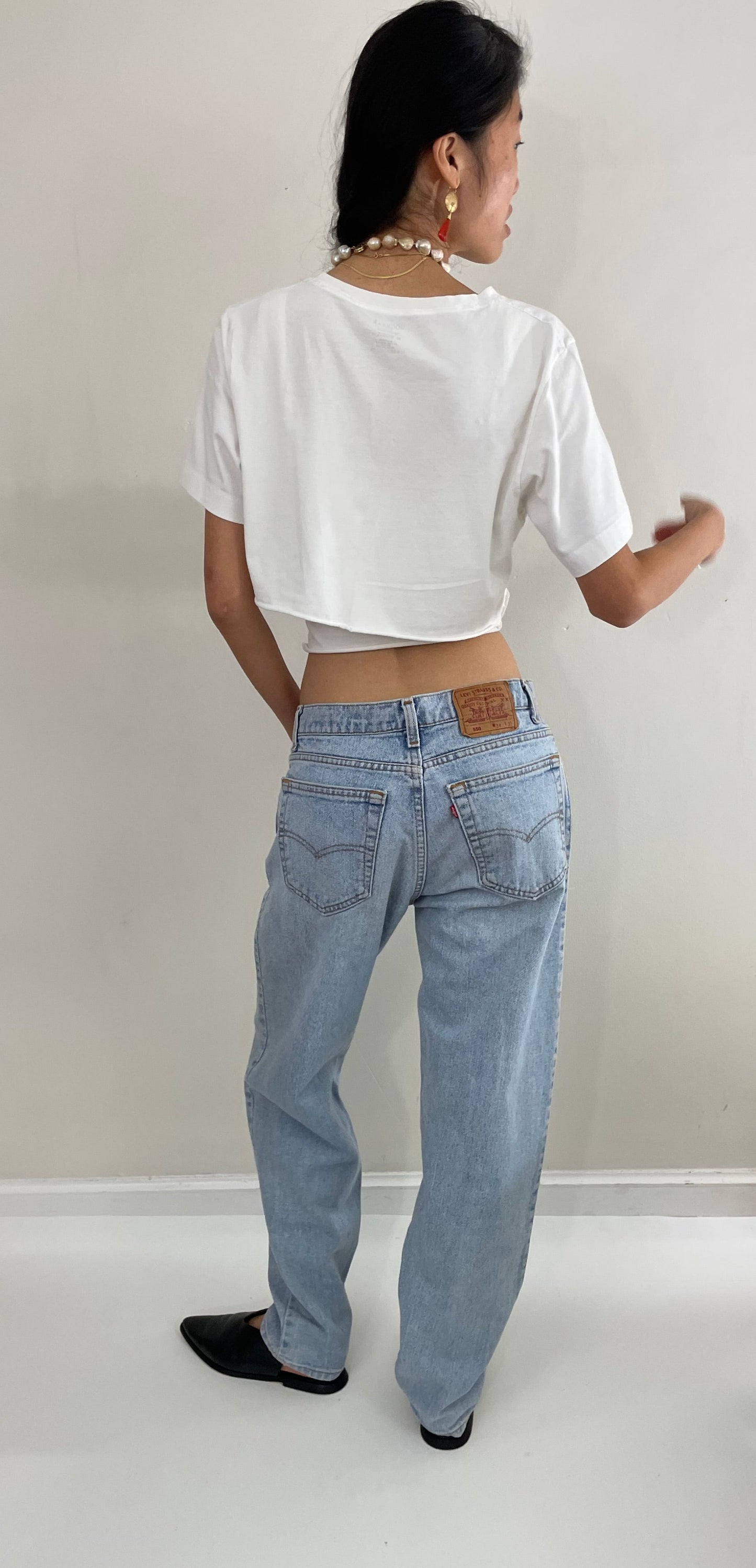 Vintage 80s Levi's faded boyfriend relaxed fit high waisted zipper fly red tab light wash Levis 550 Dad jeans made in USA size 32x32