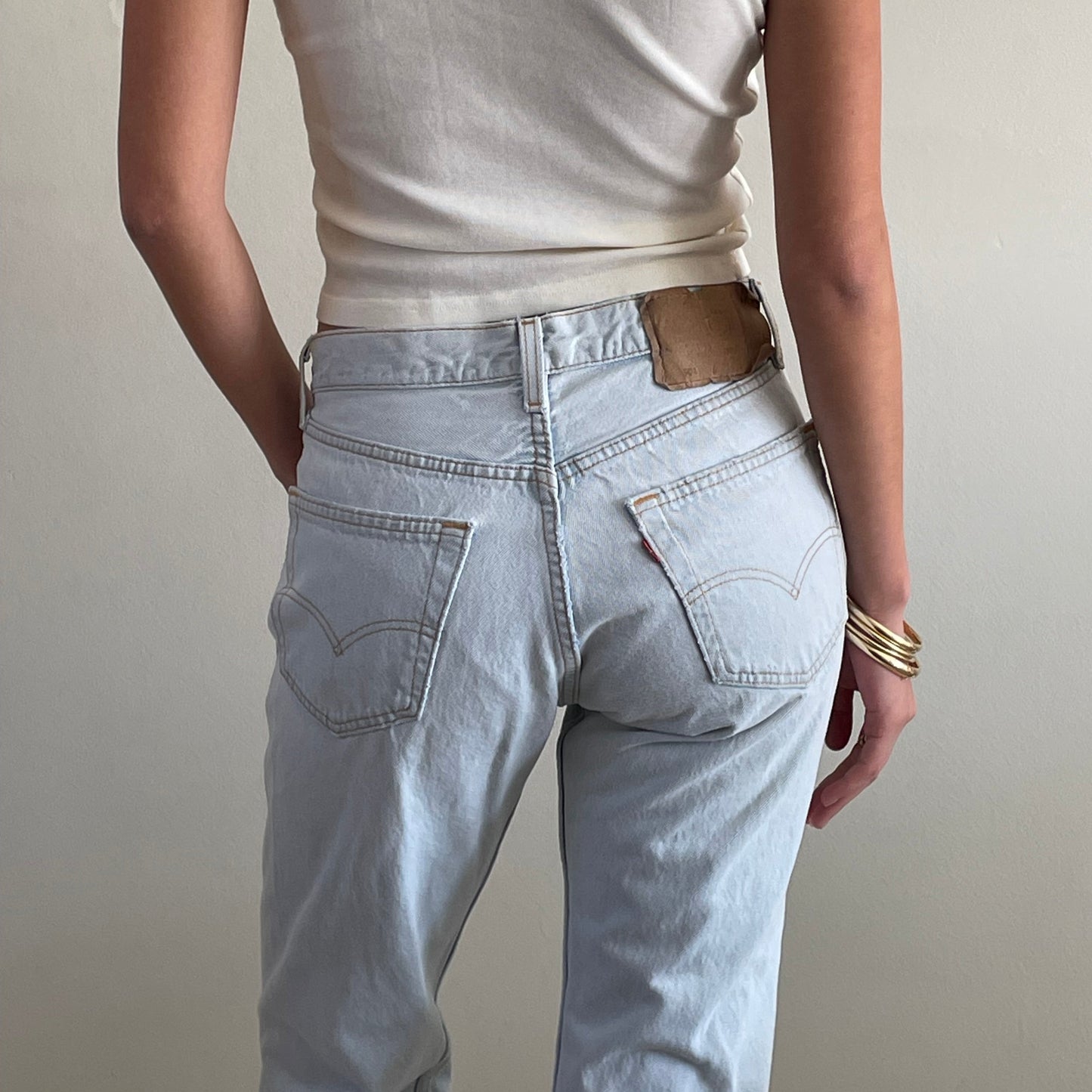 Vintage Levis 501 button fly faded boyfriend light stonewash jeans made in USA size 28