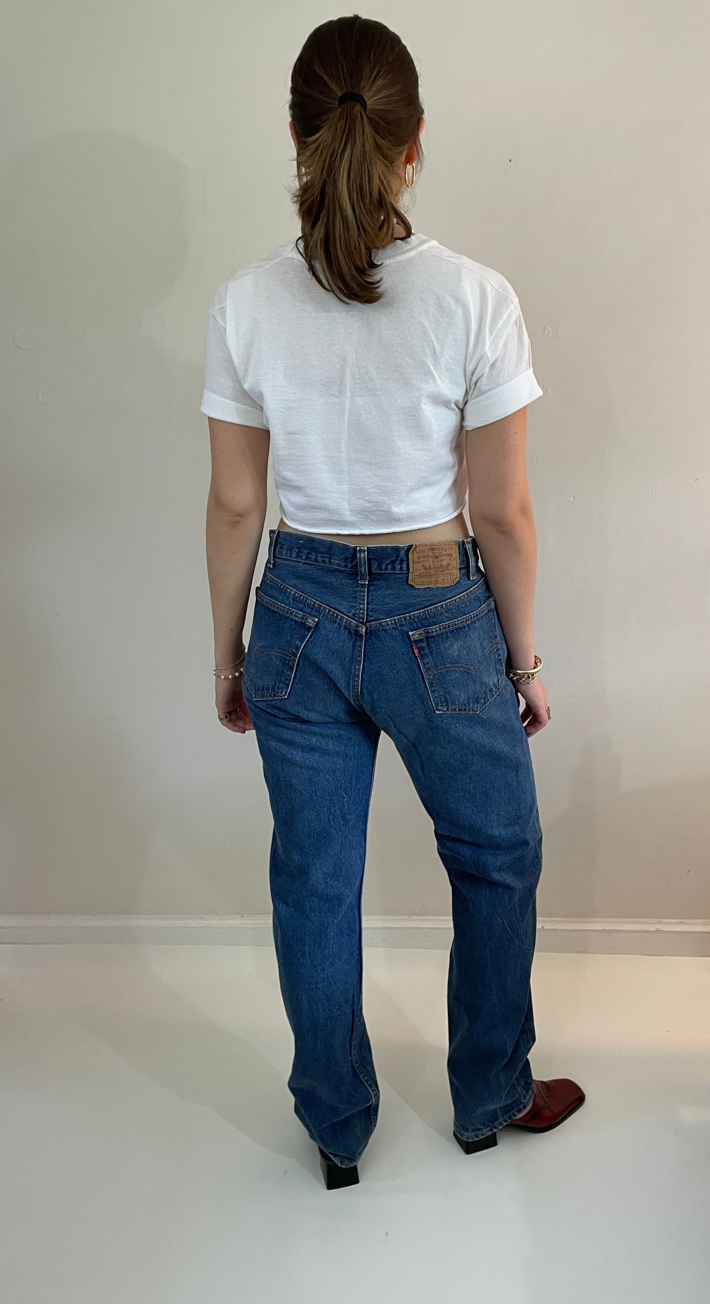 vintage Levi's 501 medium dark wash button fly tall boyfriend jeans made in USA size 33