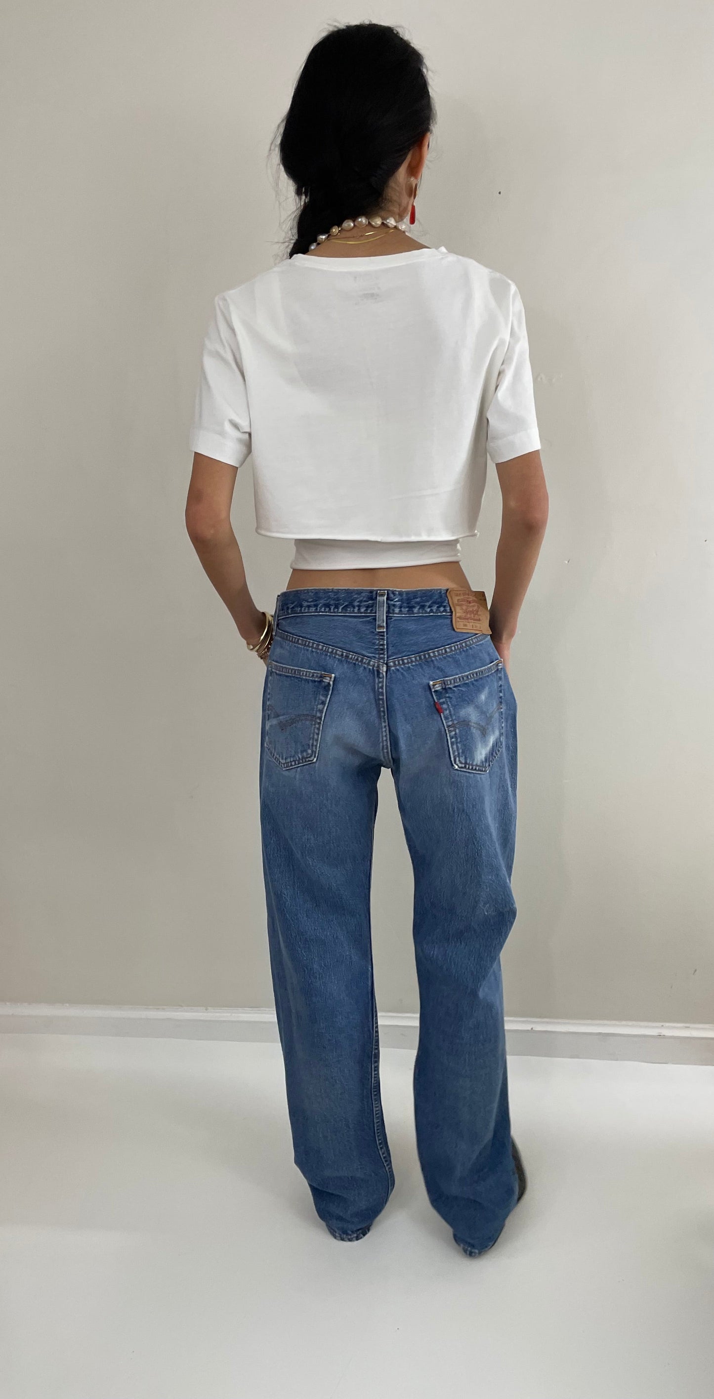 Vintage 80s Levis 501 button fly soft faded tall boyfriend baggy medium wash Levis jeans made in USA size 33 x 34