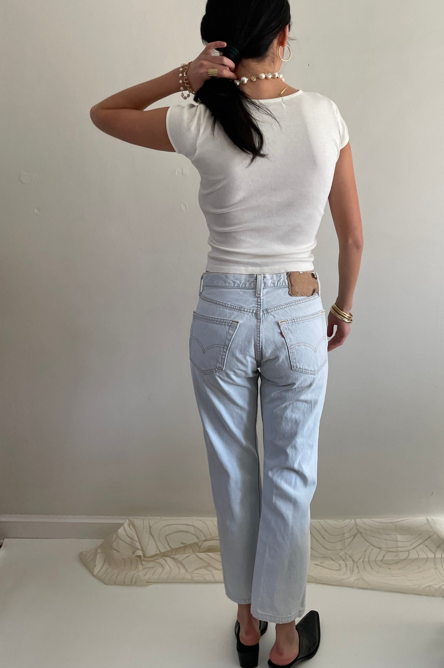 Vintage Levis 501 button fly faded boyfriend light stonewash jeans made in USA size 28
