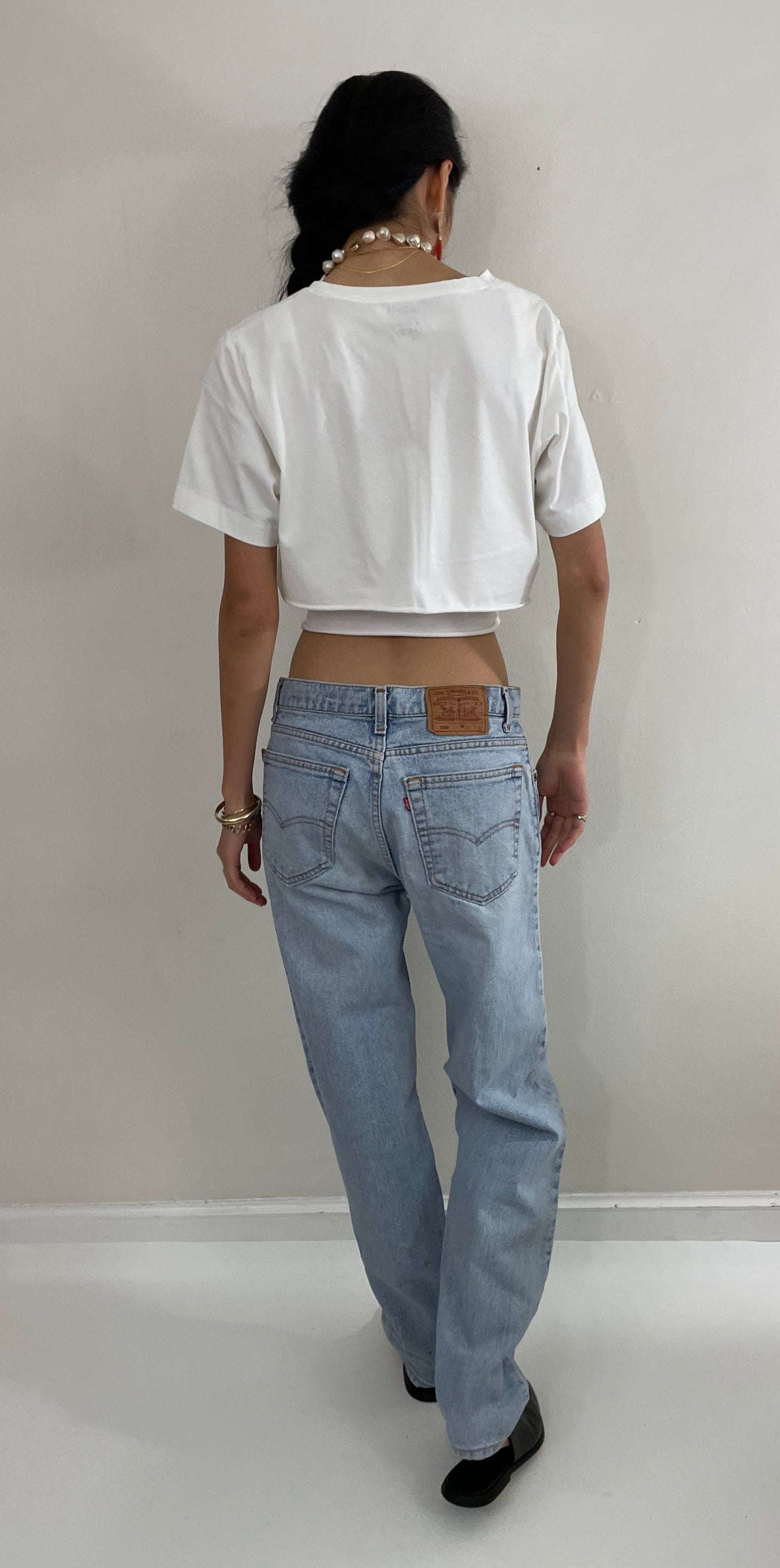 Vintage 80s Levi's faded boyfriend relaxed fit high waisted zipper fly red tab light wash Levis 550 Dad jeans made in USA size 32x32