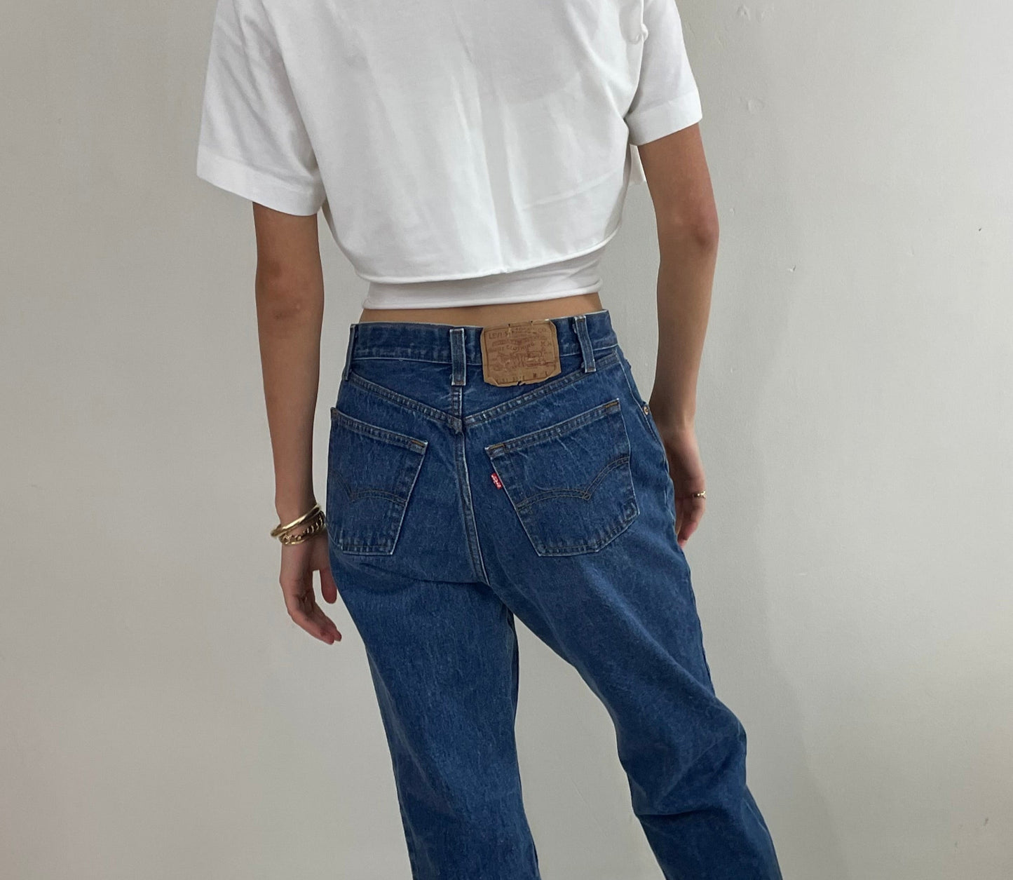 Vintage 80s Levi's 501 dark wash shrink to fit high waisted made for Women button fly tall Levis jeans size 27 x 32