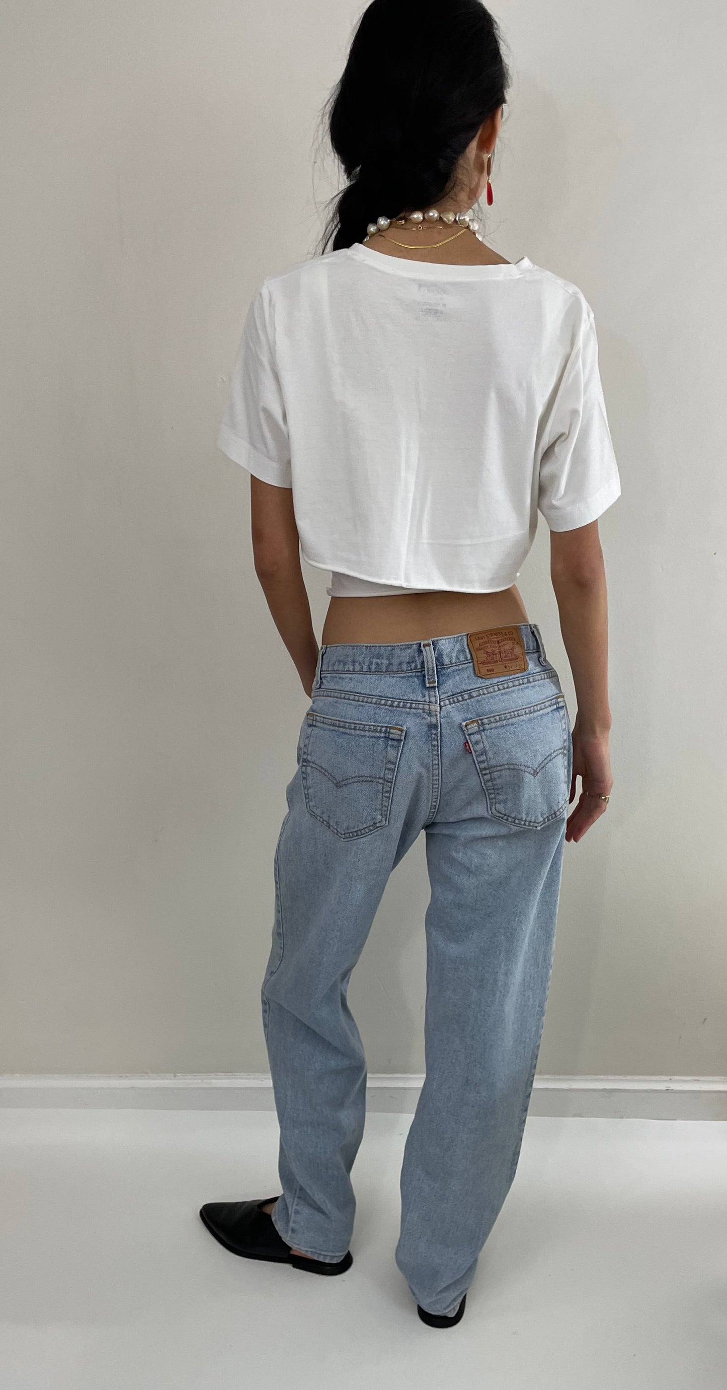Vintage 80s Levi's faded boyfriend relaxed fit high waisted zipper fly red tab light wash Levis 550 Dad jeans made in USA size 32x32