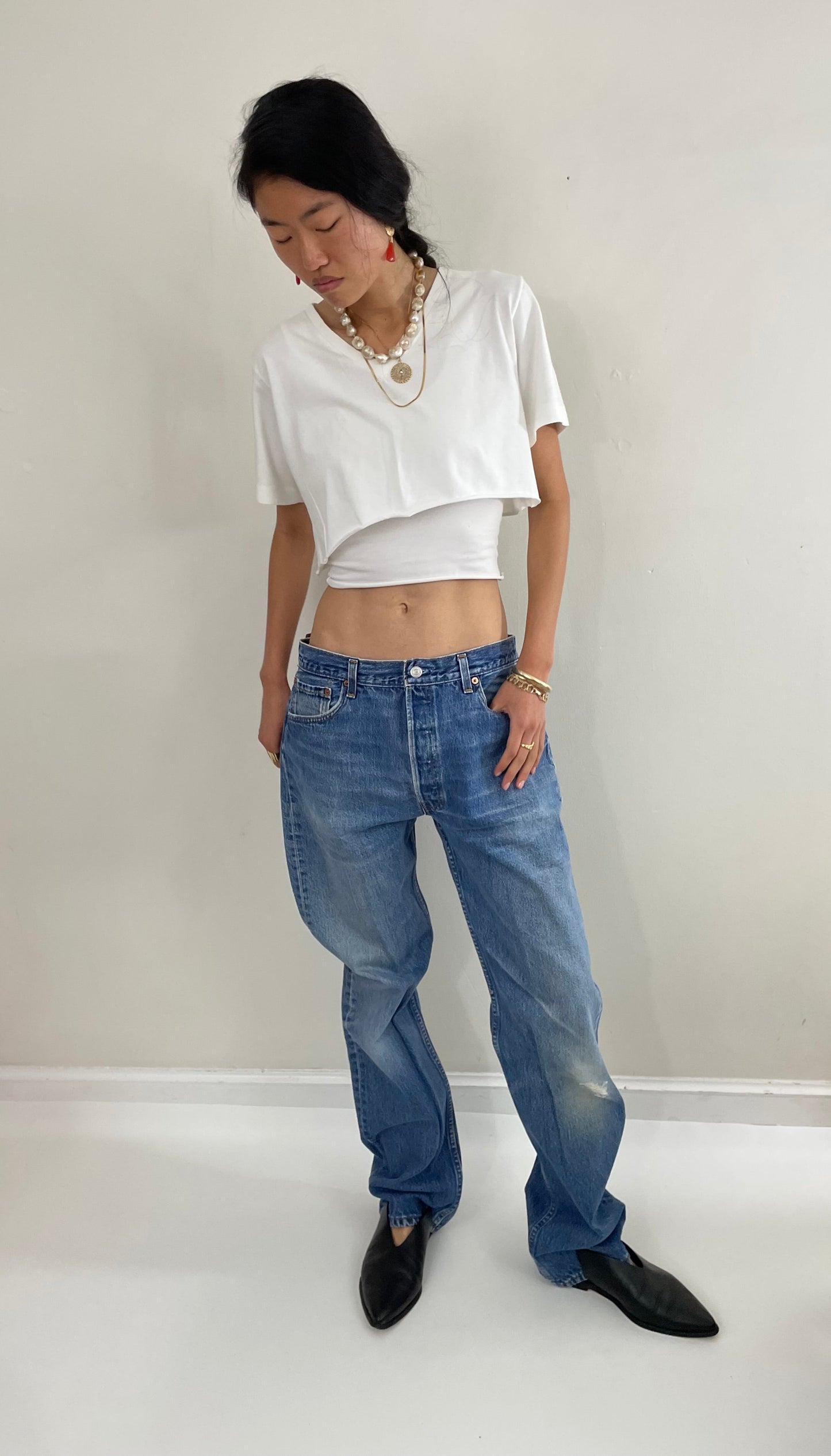 Vintage 80s Levis 501 button fly soft faded tall boyfriend baggy medium wash Levis jeans made in USA size 33 x 34