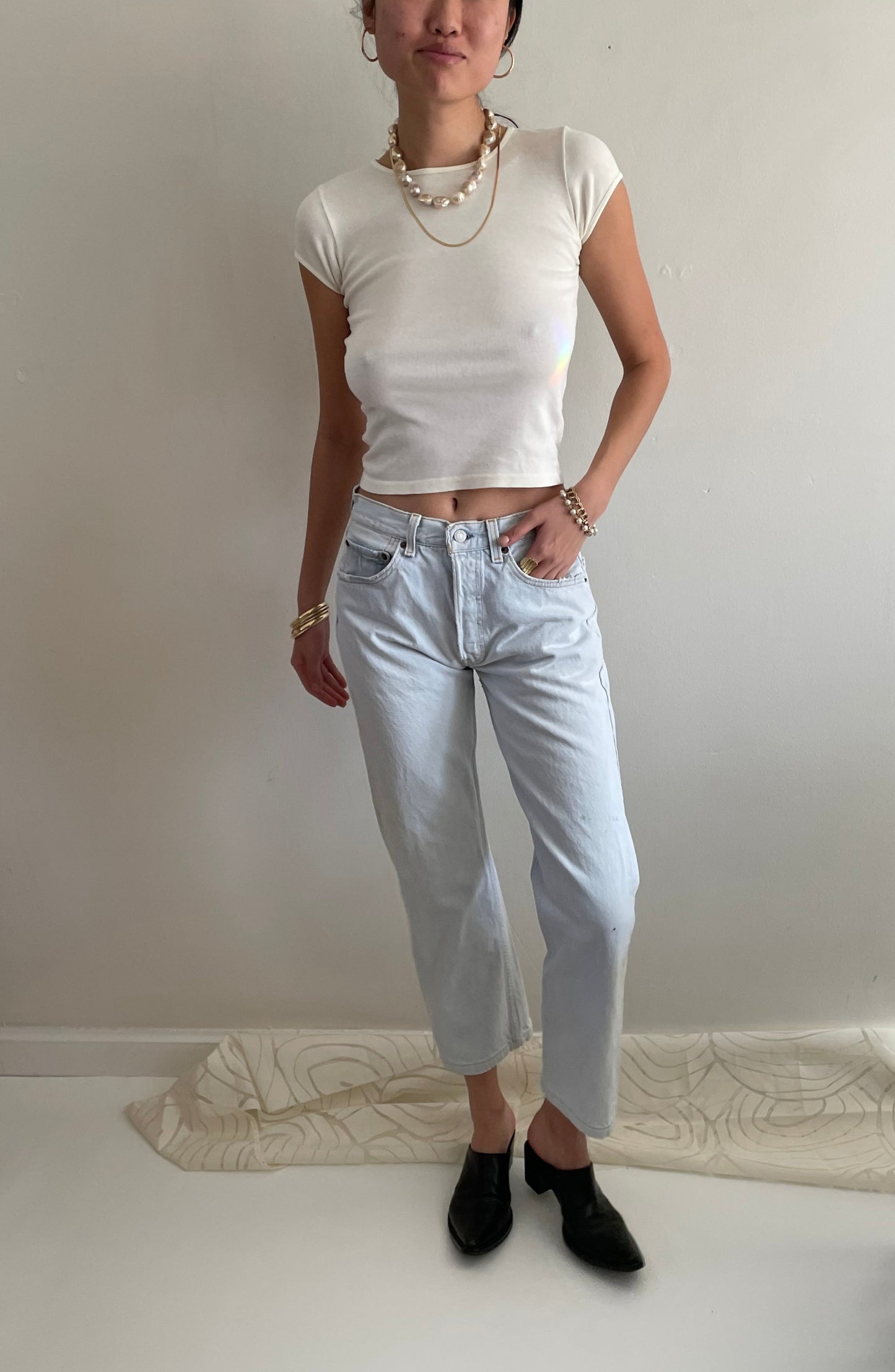 Vintage Levis 501 button fly faded boyfriend light stonewash jeans made in USA size 28
