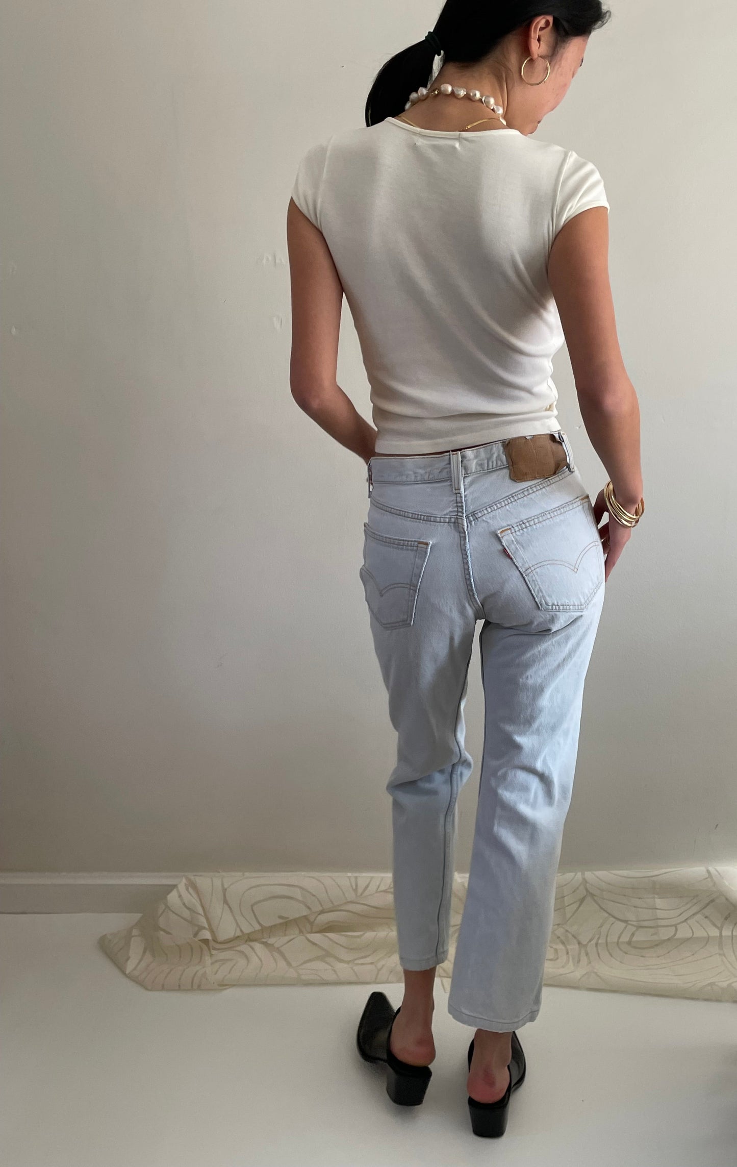 Vintage Levis 501 button fly faded boyfriend light stonewash jeans made in USA size 28