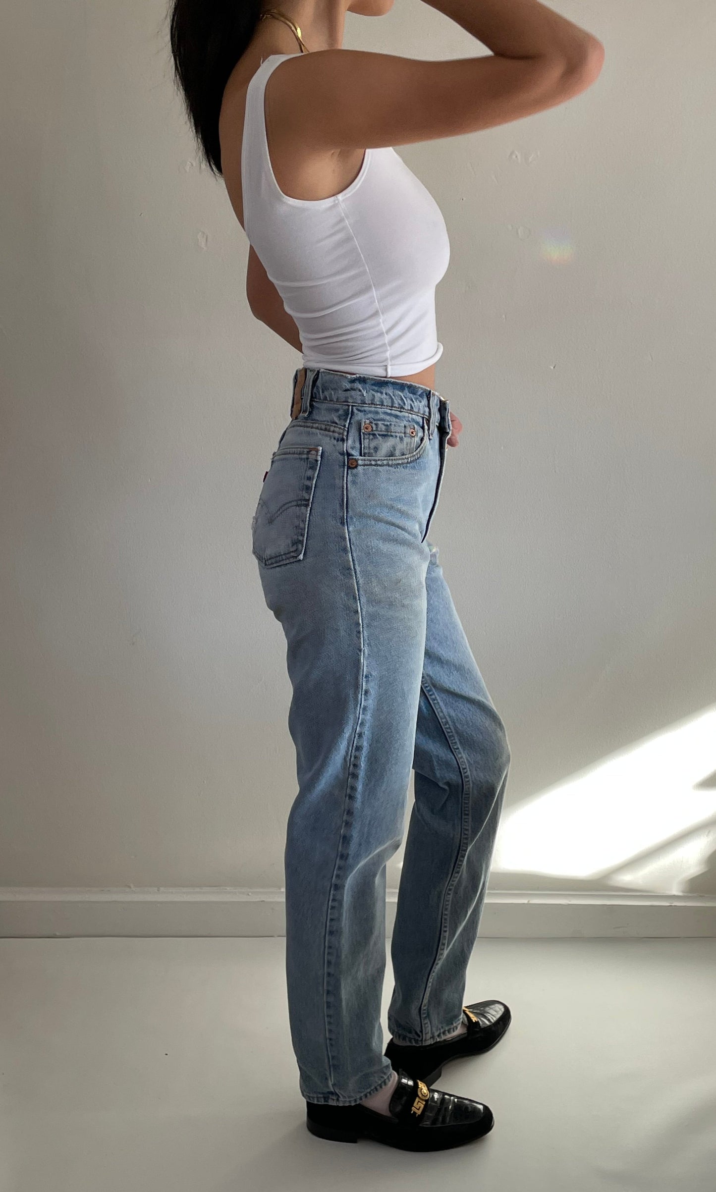 vintage Levi's 550 high waisted faded light wash zipper tall Levis jeans made in USA size 28