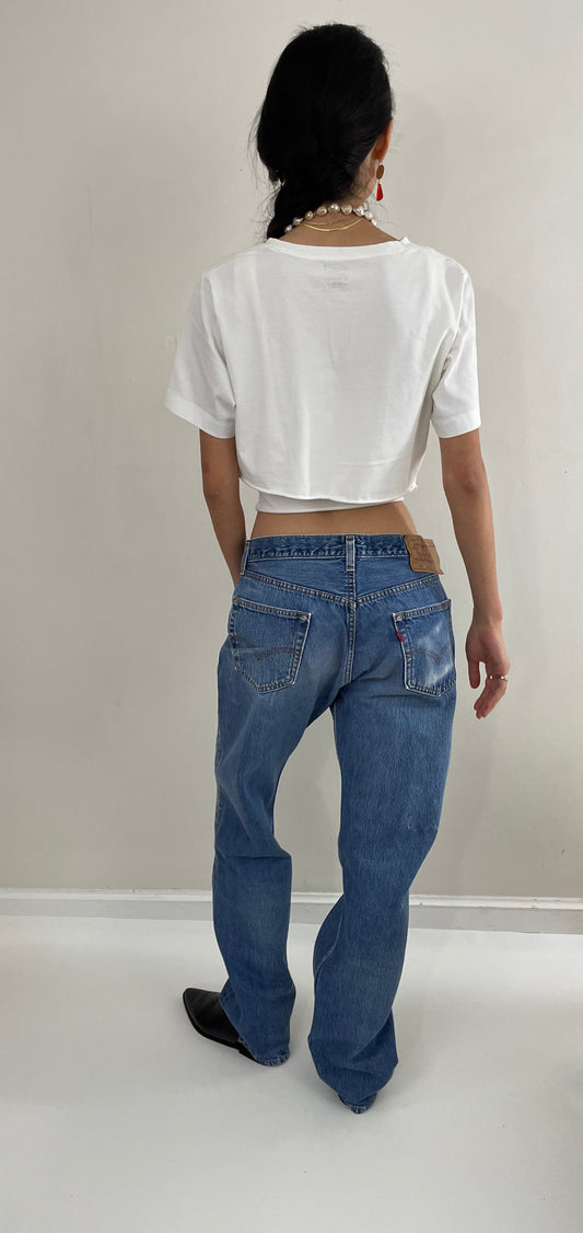 Vintage 80s Levis 501 button fly soft faded tall boyfriend baggy medium wash Levis jeans made in USA size 33 x 34