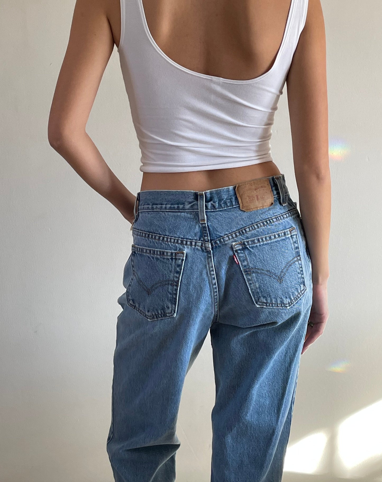 Vintage Levi's 550 high waisted faded light wash zipper Levis jeans made in USA size 29