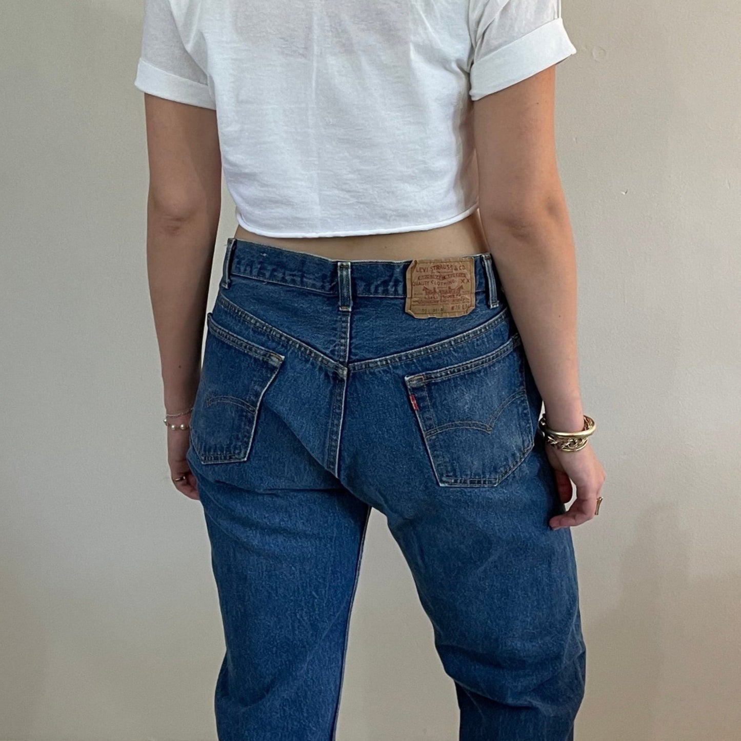 vintage Levi's 501 medium dark wash button fly tall boyfriend jeans made in USA size 33