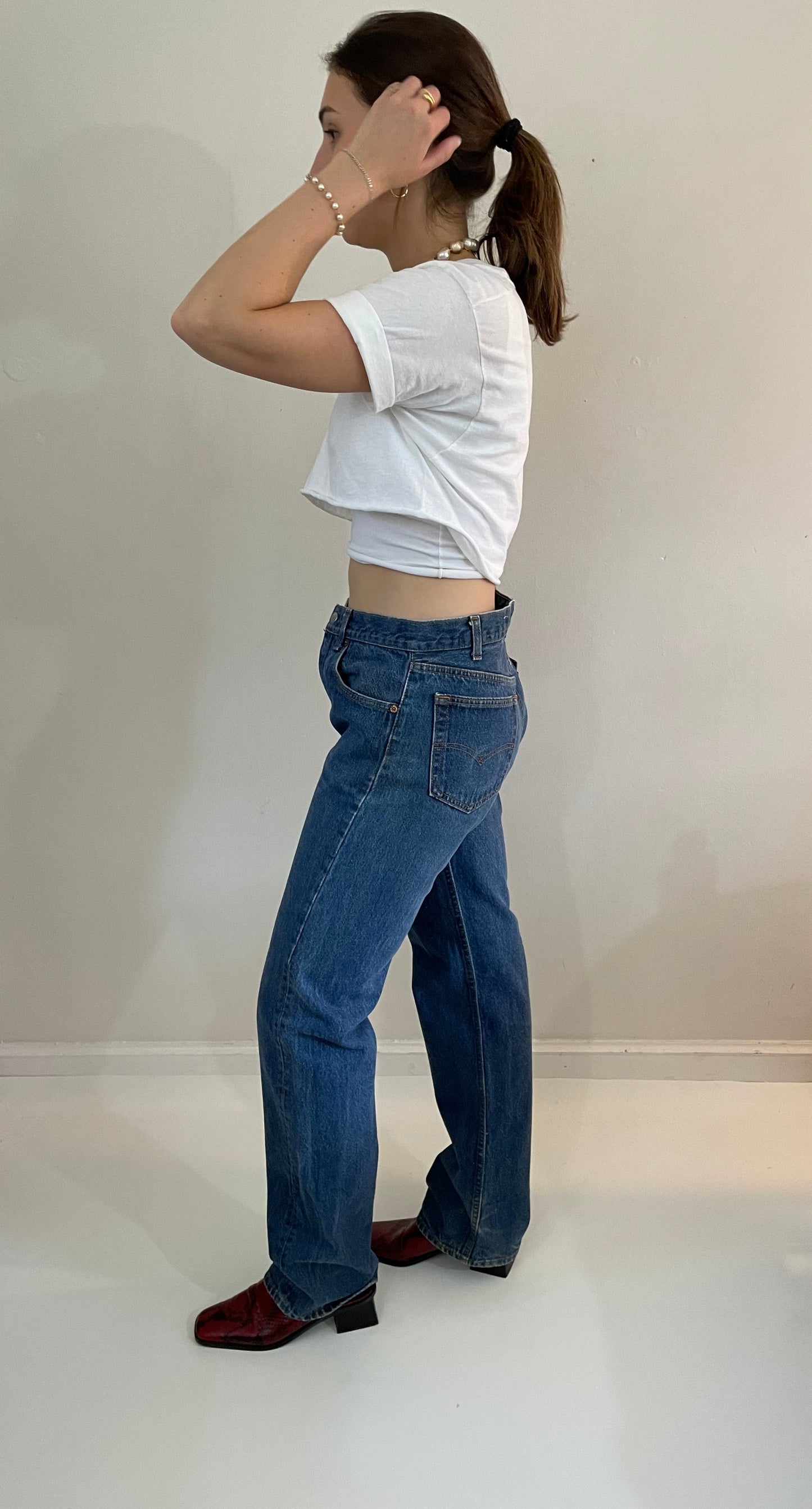 vintage Levi's 501 medium dark wash button fly tall boyfriend jeans made in USA size 33