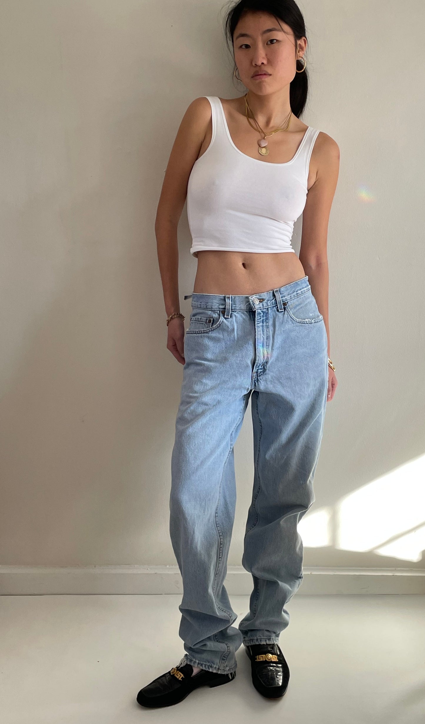 vintage Levi's 550 light wash high waisted zipper fly faded slouchy baggy Levis boyfriend jeans size 31