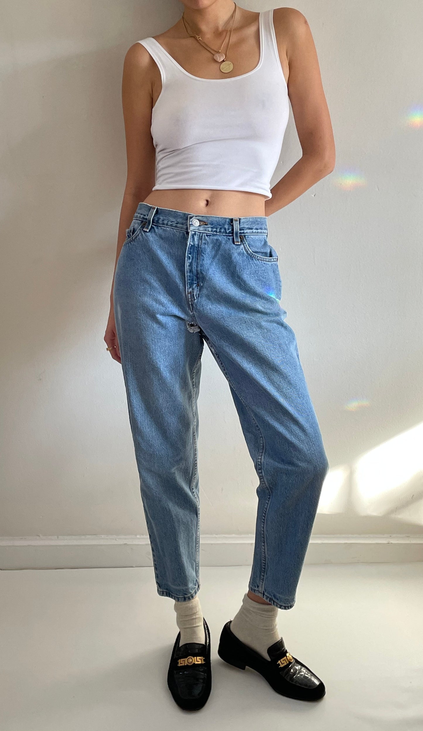 Vintage Levi's 550 high waisted faded light wash zipper Levis jeans made in USA size 29