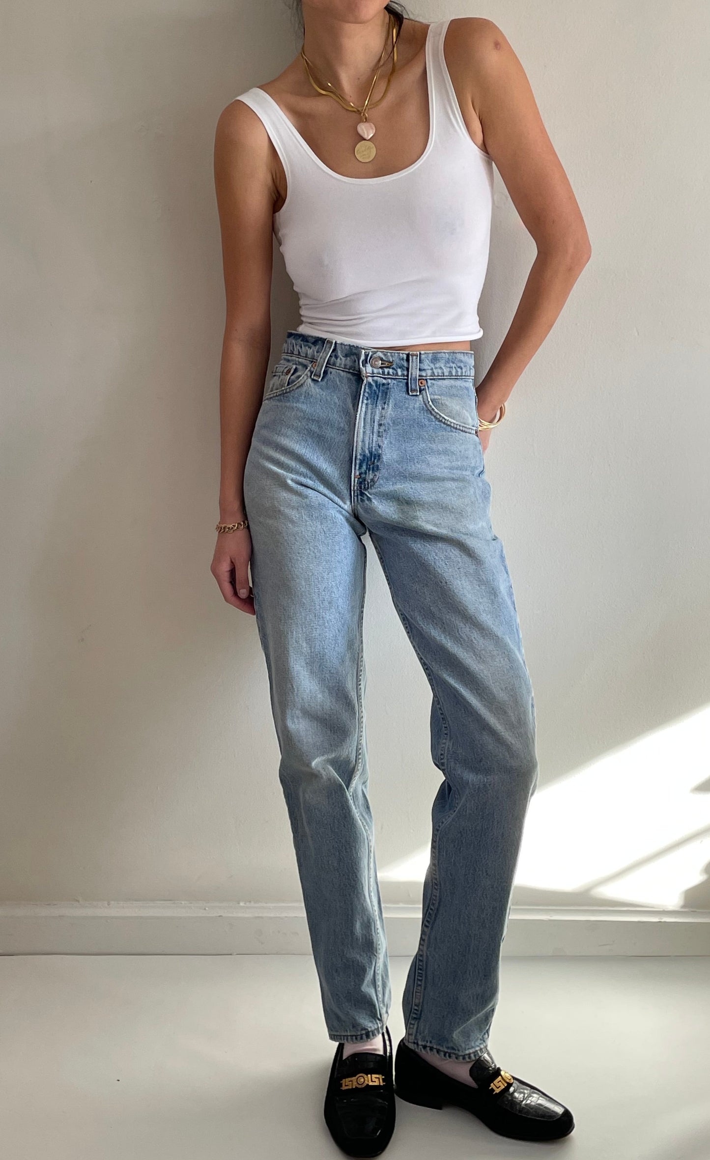 vintage Levi's 550 high waisted faded light wash zipper tall Levis jeans made in USA size 28